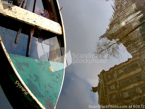 Image of sinking boat and reflection