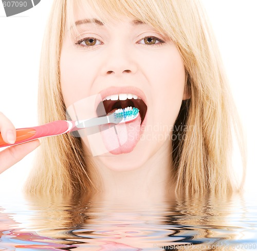 Image of happy girl with toothbrush