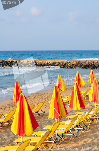 Image of sunbeds and umbrellas