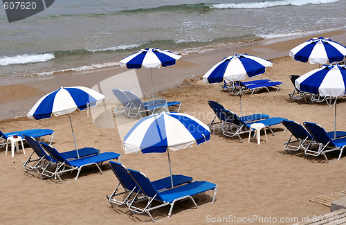 Image of sunbeds and umbrellas