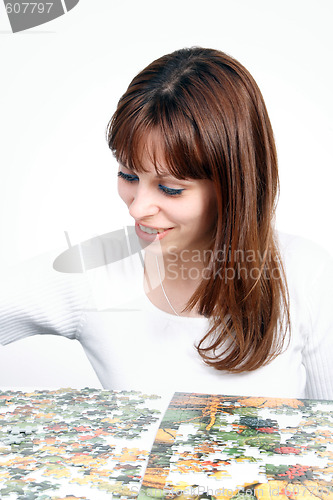 Image of woman doing  puzzle