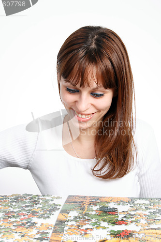 Image of woman doing  puzzle