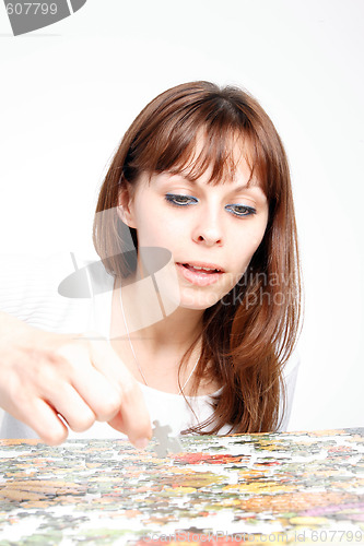 Image of woman doing  puzzle