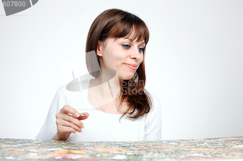 Image of woman doing  puzzle