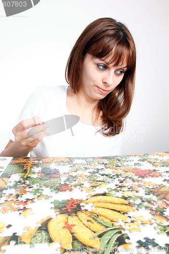 Image of woman doing  puzzle