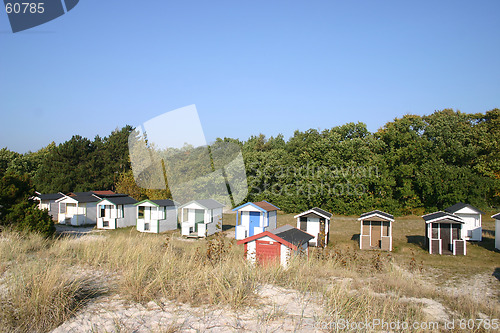 Image of at beach  exists these small house
