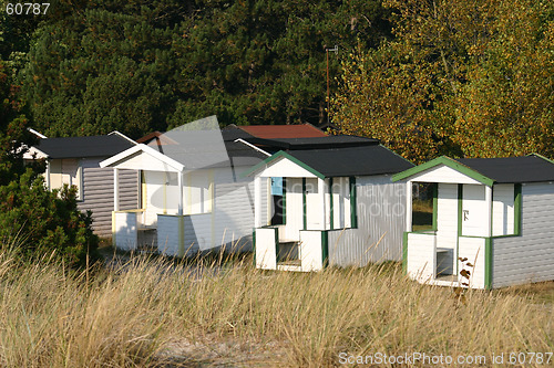 Image of at beach  exists these small house