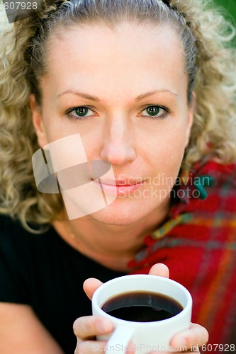 Image of woman holding a cup