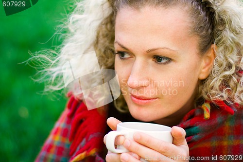 Image of woman holding a cup