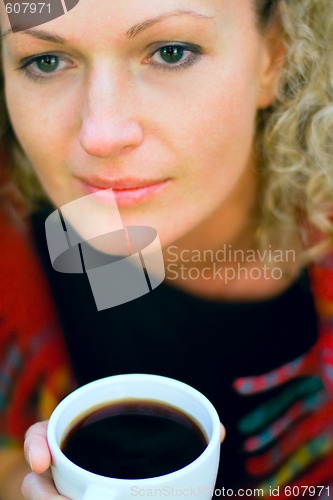 Image of woman holding a cup