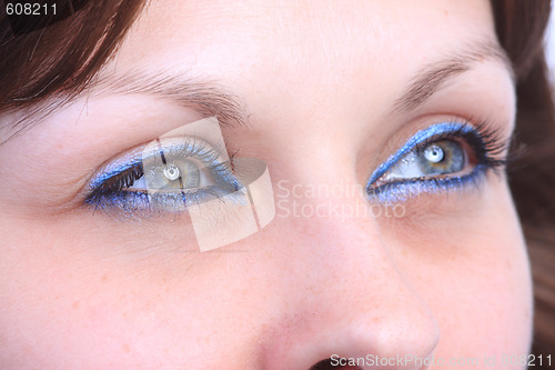 Image of beautiful woman`s open colorful eye