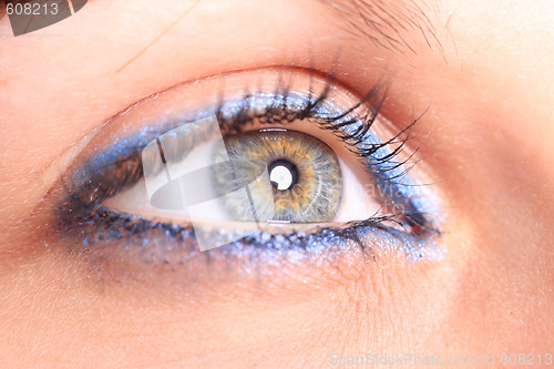 Image of beautiful woman`s open colorful eye