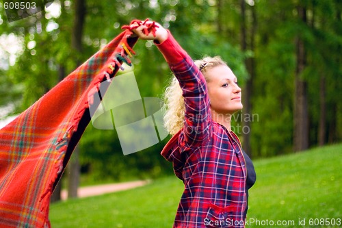 Image of woman with red coverlet