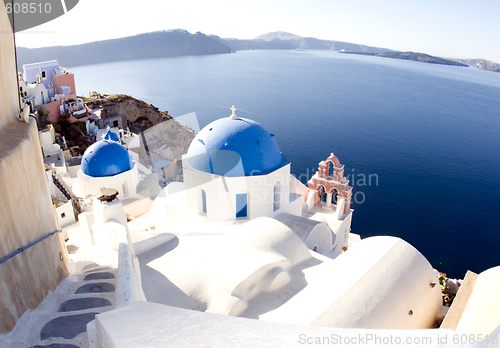 Image of santorini greek island scene with blue dome churches