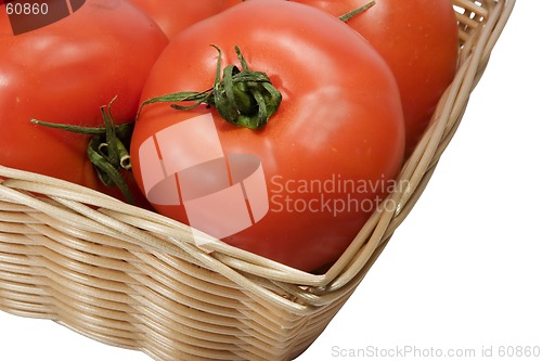 Image of Basket with tomatoes on white background with clipping path