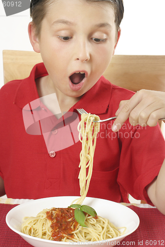 Image of Child eating spaghetti