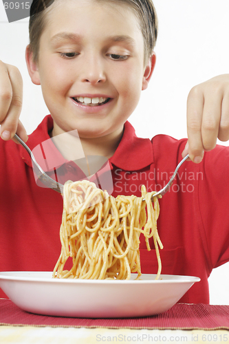 Image of Child tossing pasta