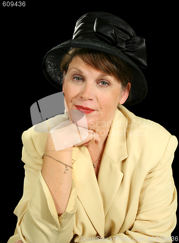 Image of Pensive Woman In Black Hat