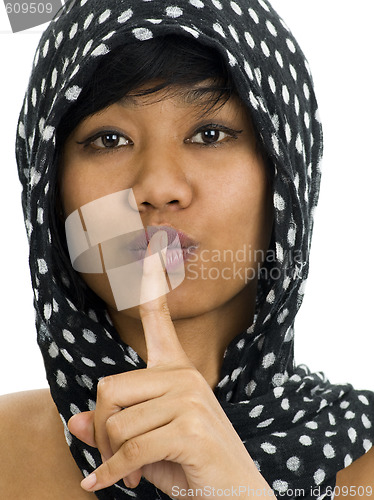 Image of asian with finger on her lips