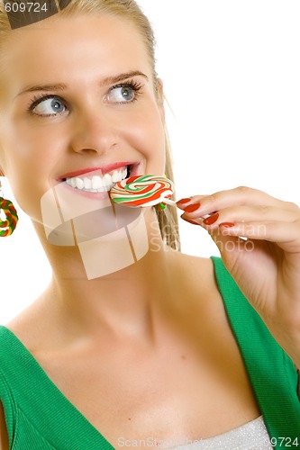 Image of closeup of an attractive woman biting a lolly pop