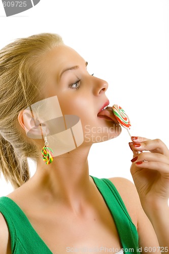 Image of closeup of an attractive woman biting a lolly pop
