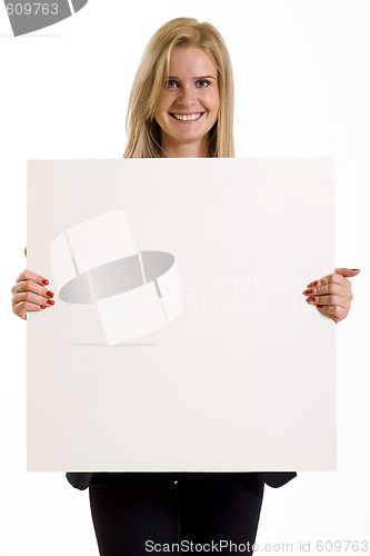 Image of attractive businesswoman holding a blank board