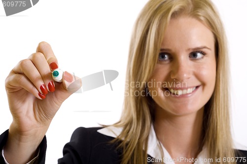 Image of businesswoman writing with marker