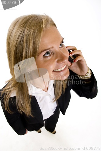 Image of   wide angle picture of an attractive businesswoman on the phone