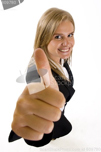 Image of wide angle picture of an attractive businesswoman making her victory sign