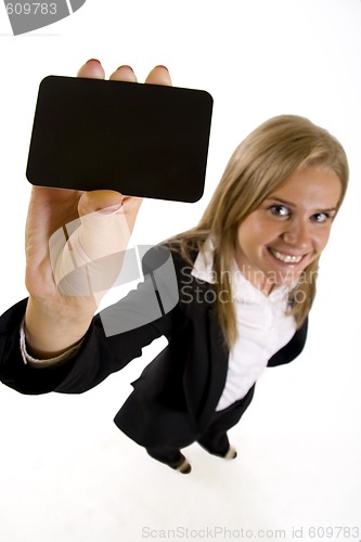 Image of wide angle picture of an attractive businesswoman presenting a blank card