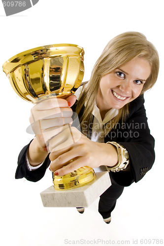 Image of wide angle picture of an attractive businesswoman winning a gold cup