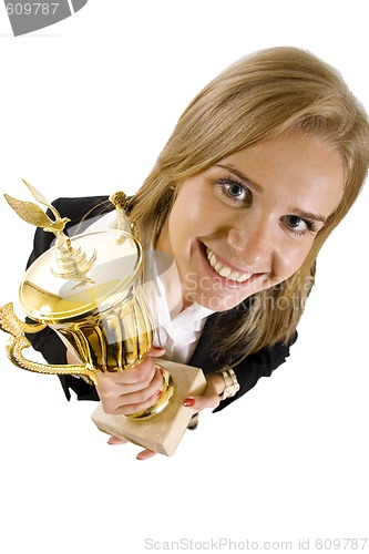 Image of wide angle picture of an attractive businesswoman winning a gold cup