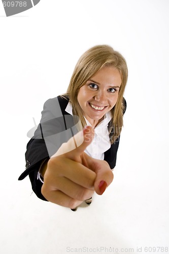 Image of wide angle picture of an attractive businesswoman pointing at you