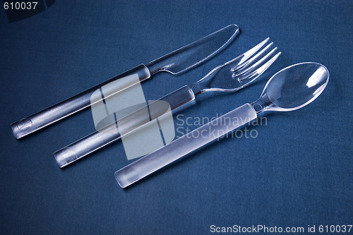 Image of Plastic cover set on blue textile background