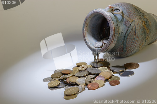 Image of coins from pitcher