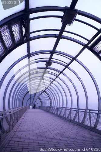 Image of glass corridor and person