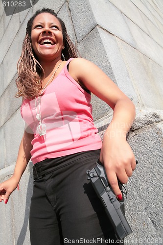 Image of woman with big black gun