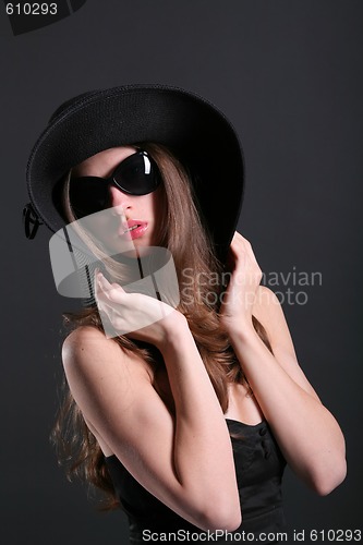 Image of young woman in the black hat