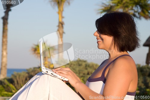 Image of lovely woman with laptop computer