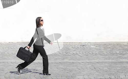 Image of Businesswoman in a hurry