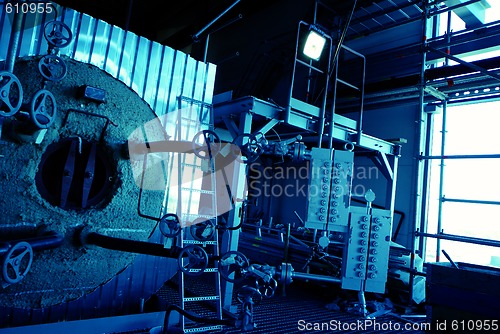 Image of Pipes, tubes, machinery and steam turbine at a power plant