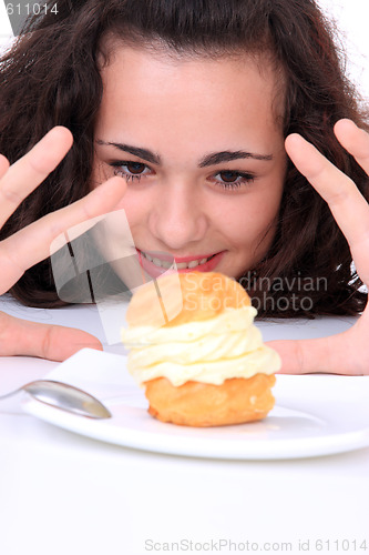 Image of Young girl eating cake