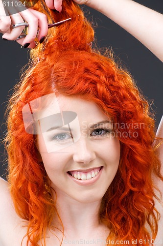 Image of redhead with scissors