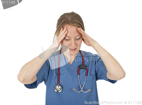 Image of Preoccupied and tired young nurse