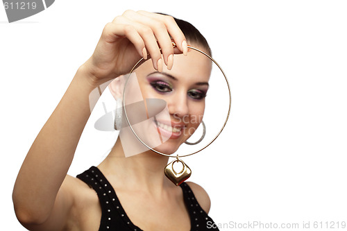 Image of Happy woman looking at golden necklace