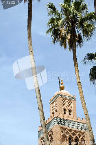 Image of koutubia mosque minaret with palm trees in koutubia gardens marr