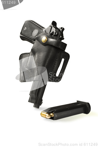 Image of handgun in holster and magazine