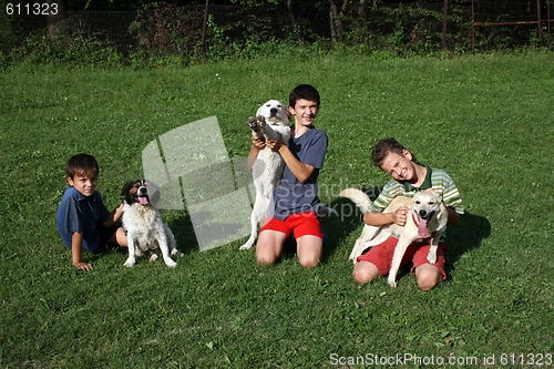 Image of happy boy with dogs