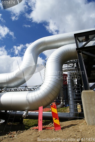 Image of Pipes, bolts, valves against blue sky