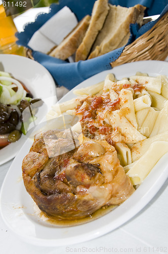 Image of lamb with pasta and greek salad taverna restaurant 